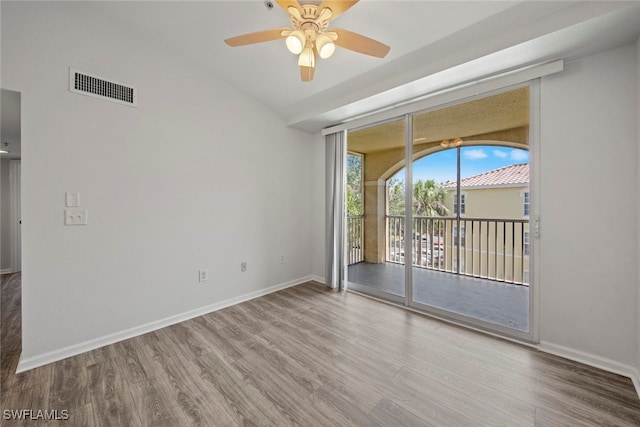 spare room with ceiling fan and hardwood / wood-style flooring