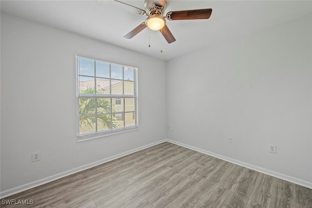 unfurnished room featuring light wood-type flooring and ceiling fan