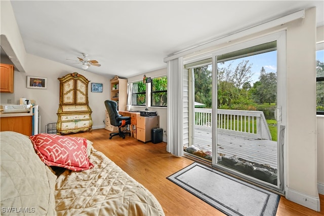 living room with light hardwood / wood-style floors and ceiling fan