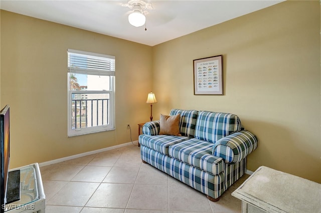 tiled living room with ceiling fan