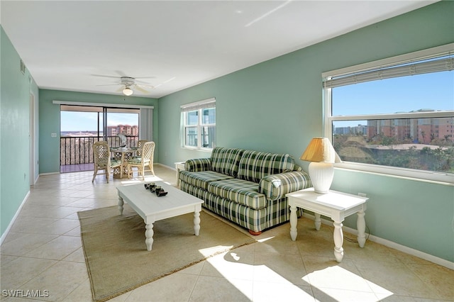 6893 Estero Blvd Unit 456, Fort Myers Beach, FL 33931 - living room featuring tile patterned floors, ceiling fan, and baseboards