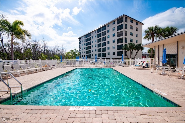 view of swimming pool with a patio area