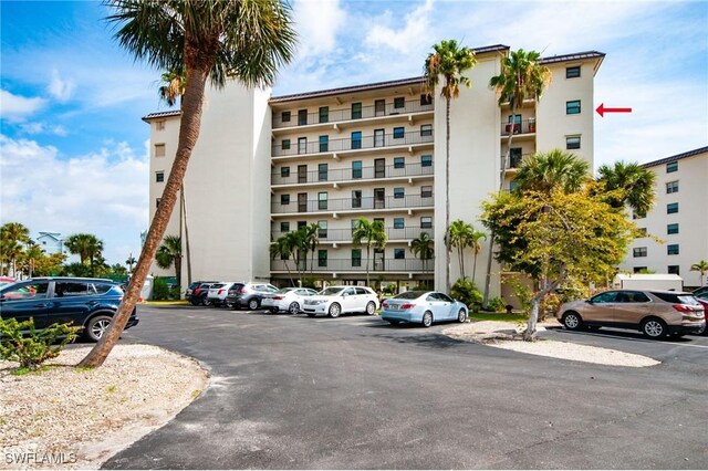 6893 Estero Blvd Unit 456, Fort Myers Beach, FL 33931 - view of apartment building / complex featuring uncovered parking