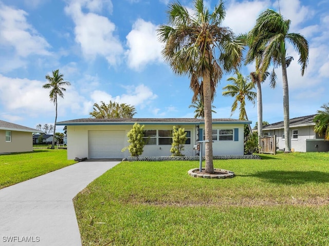 ranch-style home with a front yard and a garage