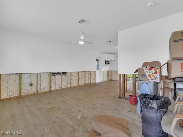 interior space featuring ceiling fan and light wood-type flooring