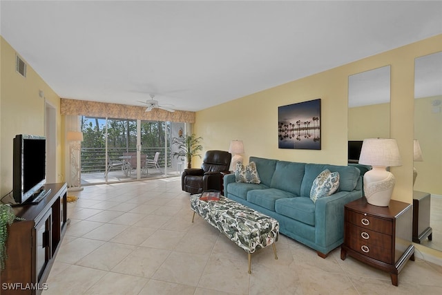 living room with light tile patterned floors and ceiling fan