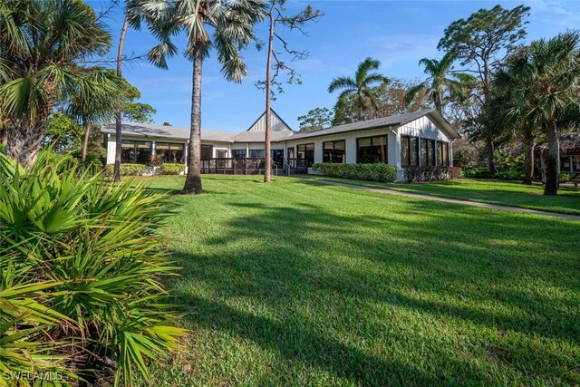 view of yard featuring a sunroom