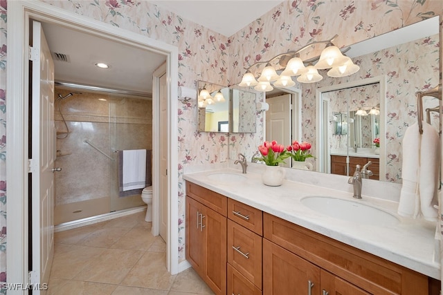 bathroom with toilet, an enclosed shower, vanity, and tile patterned flooring