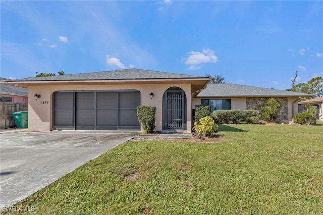 ranch-style house with a front lawn and a garage