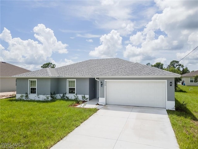 ranch-style home with a garage and a front lawn