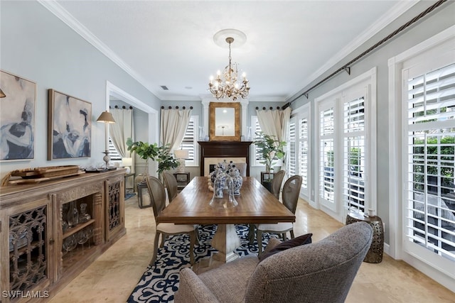 dining area with crown molding and a chandelier