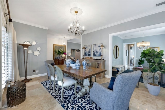 dining space with crown molding and an inviting chandelier