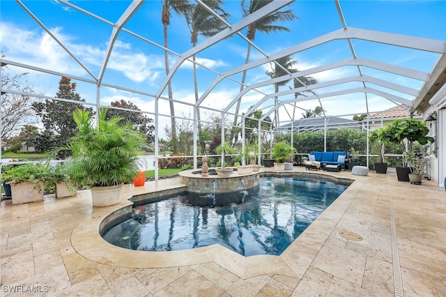 view of swimming pool featuring a lanai, a patio area, outdoor lounge area, and an in ground hot tub