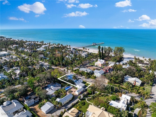 aerial view featuring a water view and a beach view