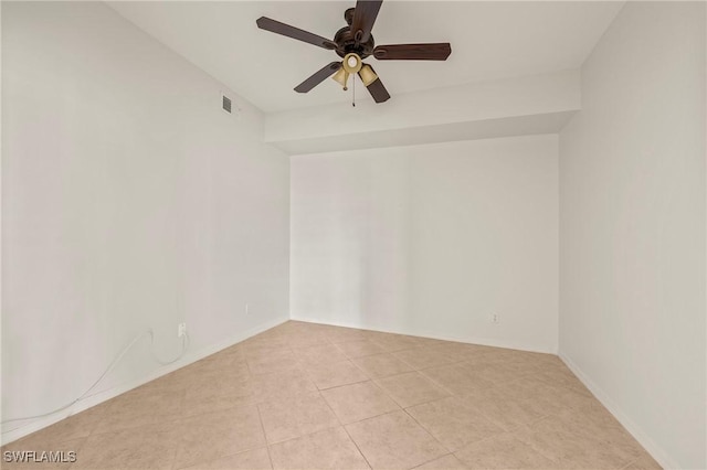 unfurnished room with ceiling fan and light tile patterned flooring