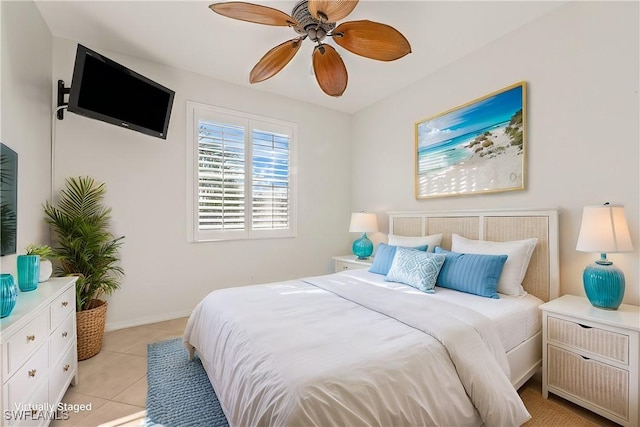 bedroom with ceiling fan and light tile patterned flooring