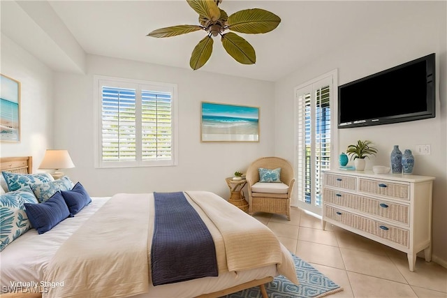 bedroom with ceiling fan and light tile patterned floors