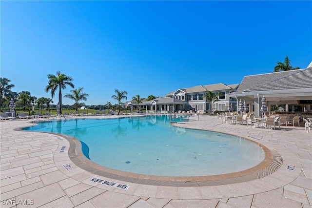 view of swimming pool featuring a patio area