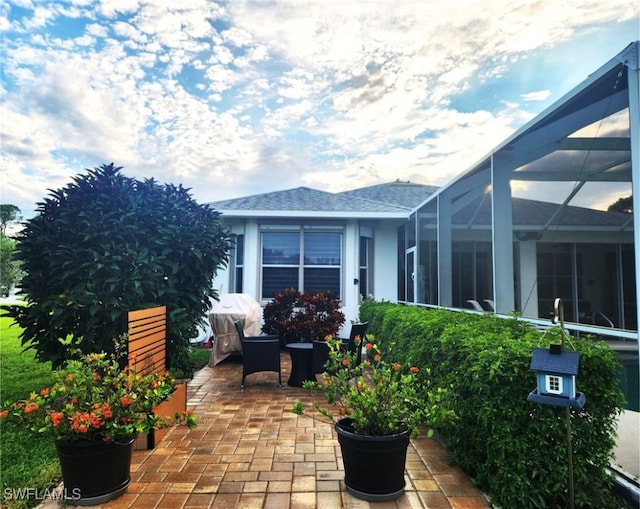 view of patio with a lanai