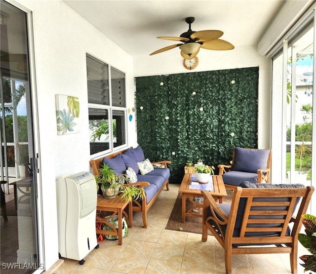 sunroom with ceiling fan