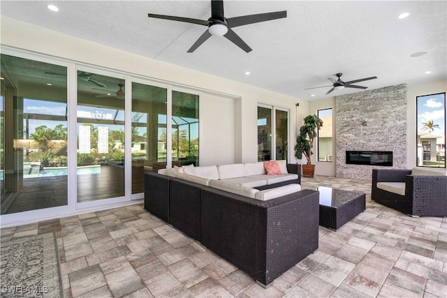 view of patio featuring ceiling fan and outdoor lounge area