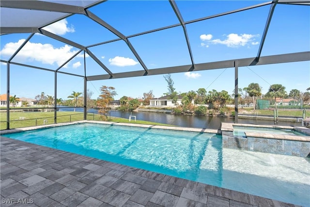 view of pool with an in ground hot tub, a lanai, a water view, and a patio