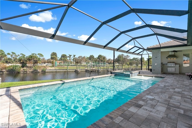 view of swimming pool with glass enclosure, an in ground hot tub, a water view, exterior kitchen, and a patio