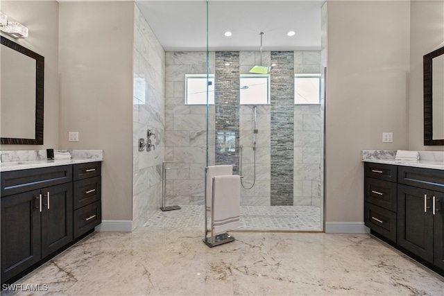 bathroom featuring vanity and a tile shower