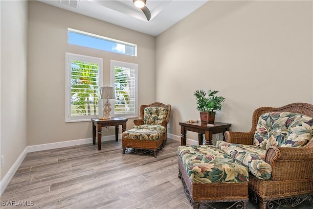 sitting room featuring ceiling fan and light hardwood / wood-style flooring