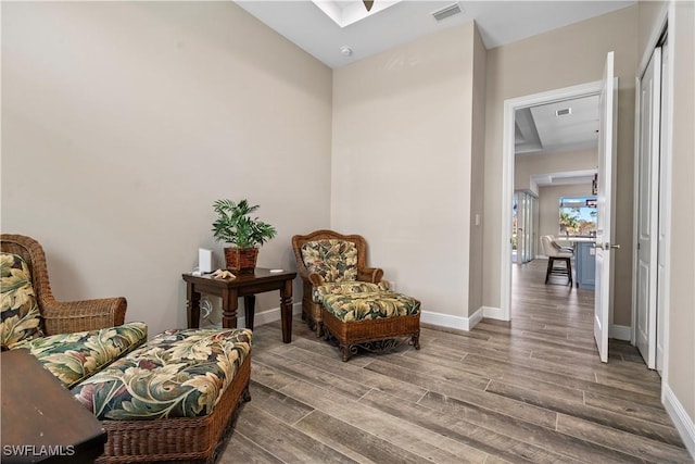 living area with wood-type flooring