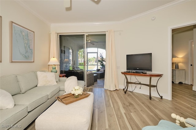 living room featuring light hardwood / wood-style floors, crown molding, and ceiling fan