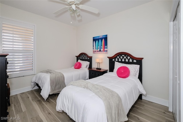 bedroom featuring ceiling fan and light wood-type flooring