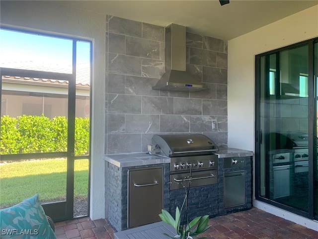 view of patio / terrace featuring a grill and exterior kitchen