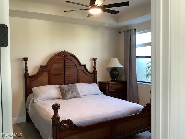 bedroom with hardwood / wood-style flooring and ceiling fan