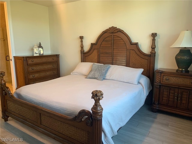 bedroom with wood-type flooring