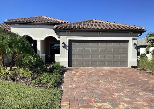 mediterranean / spanish-style home featuring a garage