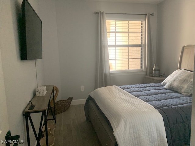 bedroom featuring dark hardwood / wood-style floors