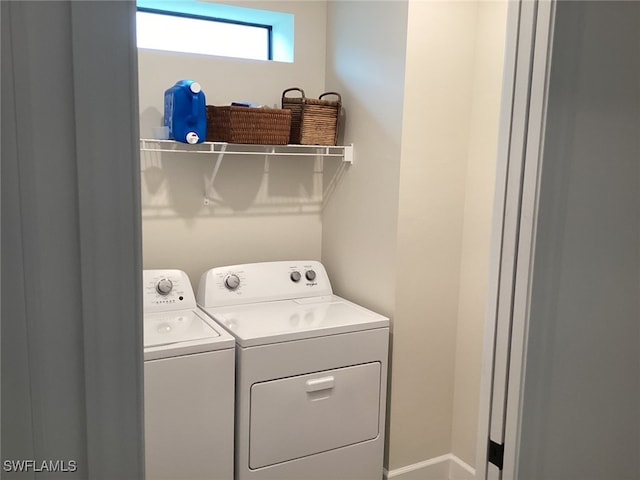 laundry room with separate washer and dryer