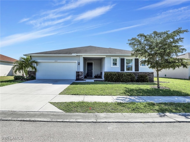 view of front of house featuring a garage and a front lawn