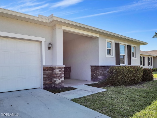 view of exterior entry with a garage