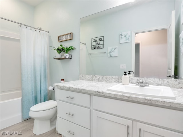 full bathroom featuring hardwood / wood-style flooring, vanity, toilet, and shower / tub combo with curtain