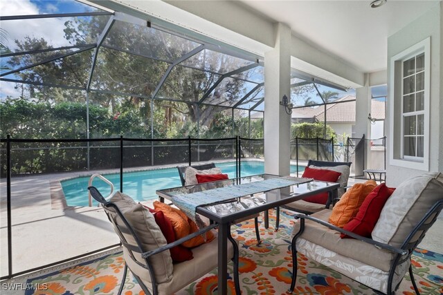 view of swimming pool featuring a patio and glass enclosure