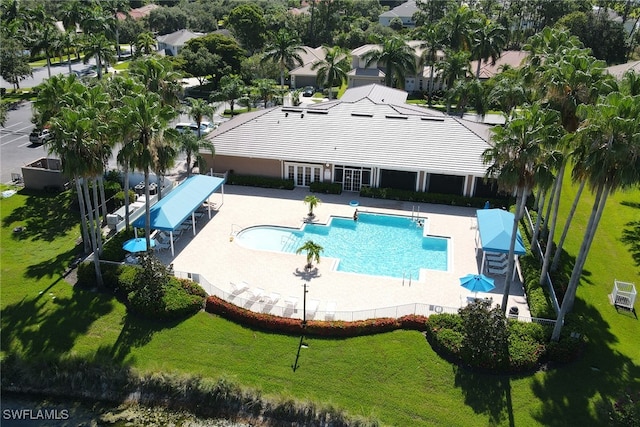 view of pool with a yard and a patio