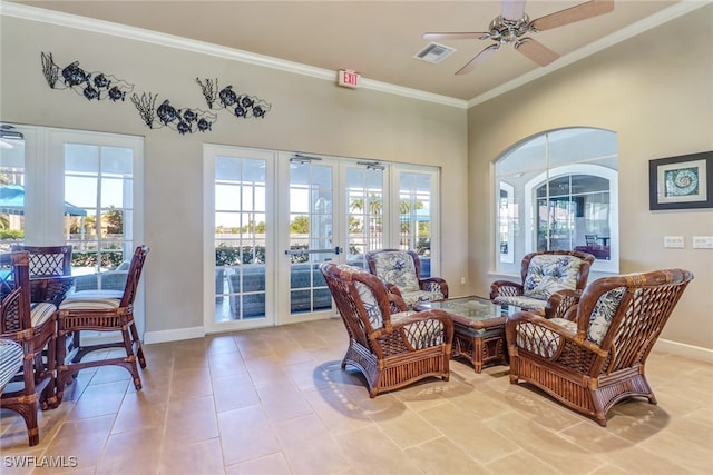 sitting room featuring french doors, light tile patterned flooring, plenty of natural light, and ceiling fan