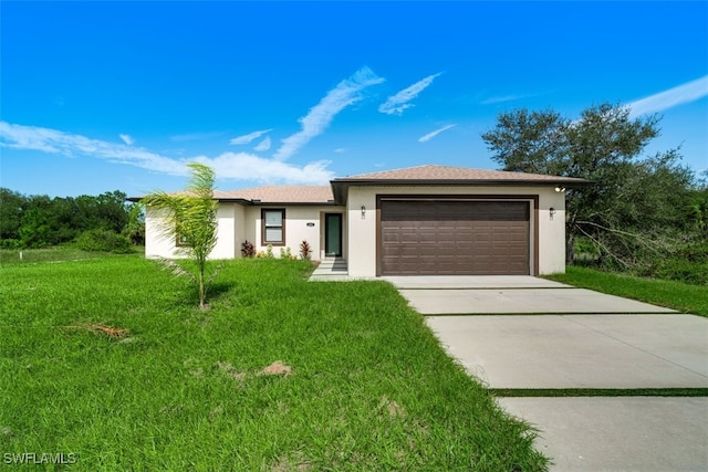 single story home with a front yard and a garage