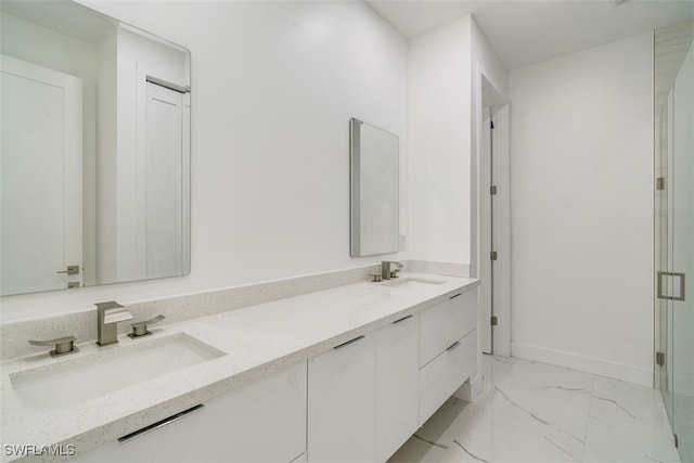 bathroom featuring vanity and a shower with shower door