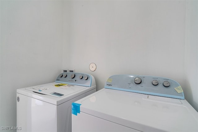 laundry room with independent washer and dryer