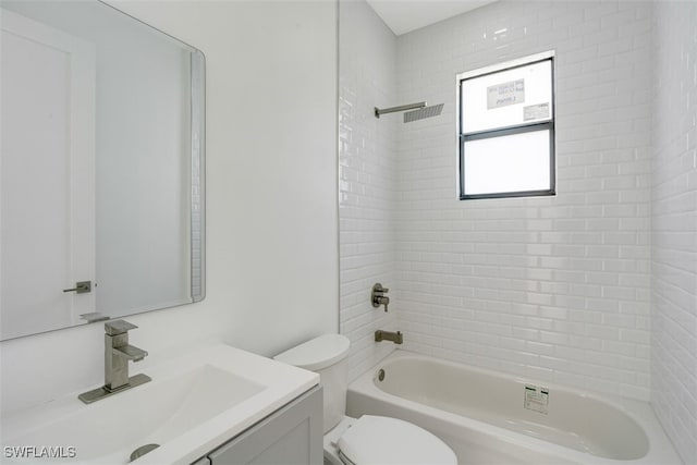 full bathroom with vanity, tiled shower / bath combo, and toilet