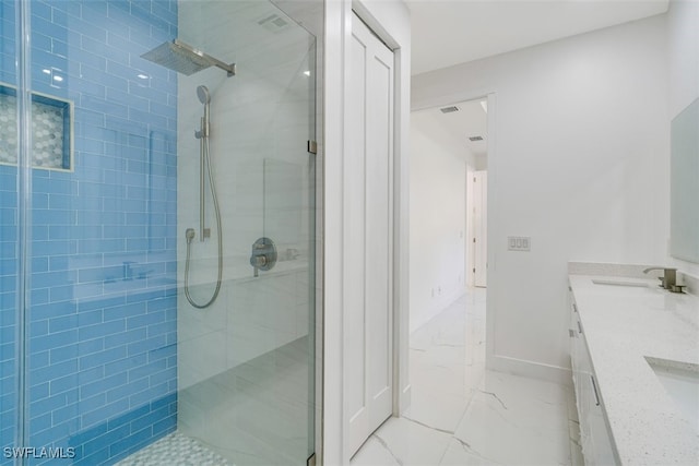 bathroom with vanity and walk in shower