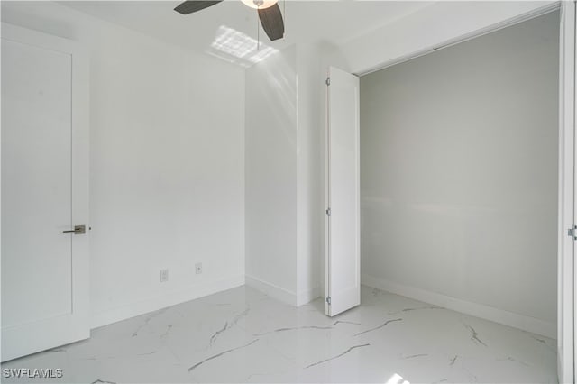 unfurnished bedroom featuring ceiling fan